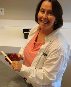 Picture of Therese Willkomm with PVC pipe and pliers Picture of Therese Willkomm with PVC pipe and pliers